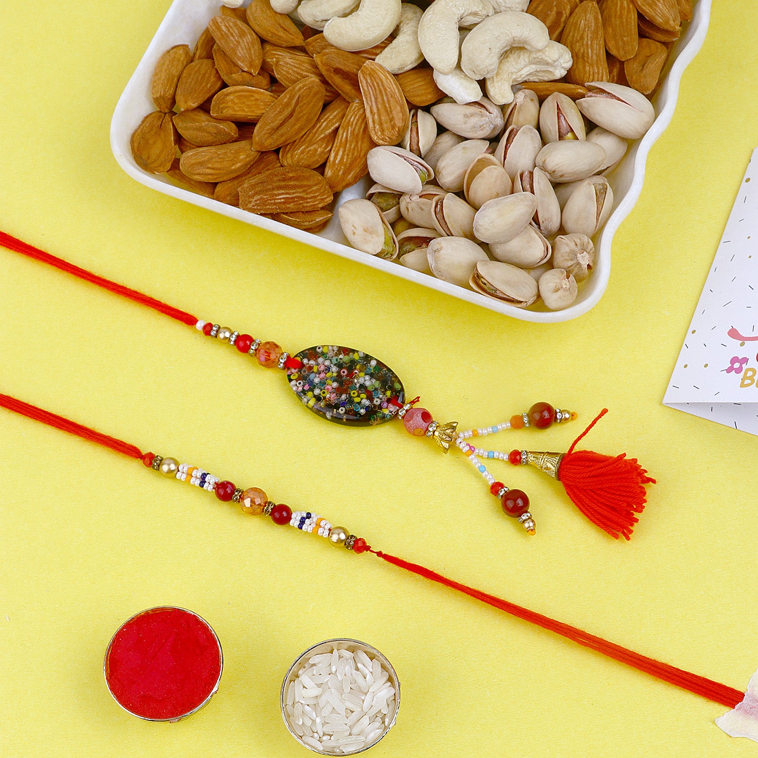 Sweet Harmony Rakhi and Delectable Dry Fruits for Festive Joy Sweet Harmony Rakhi and Delectable Dry Fruits for Festive Joy